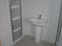 new bathroom suite and tiling to bathroom walls